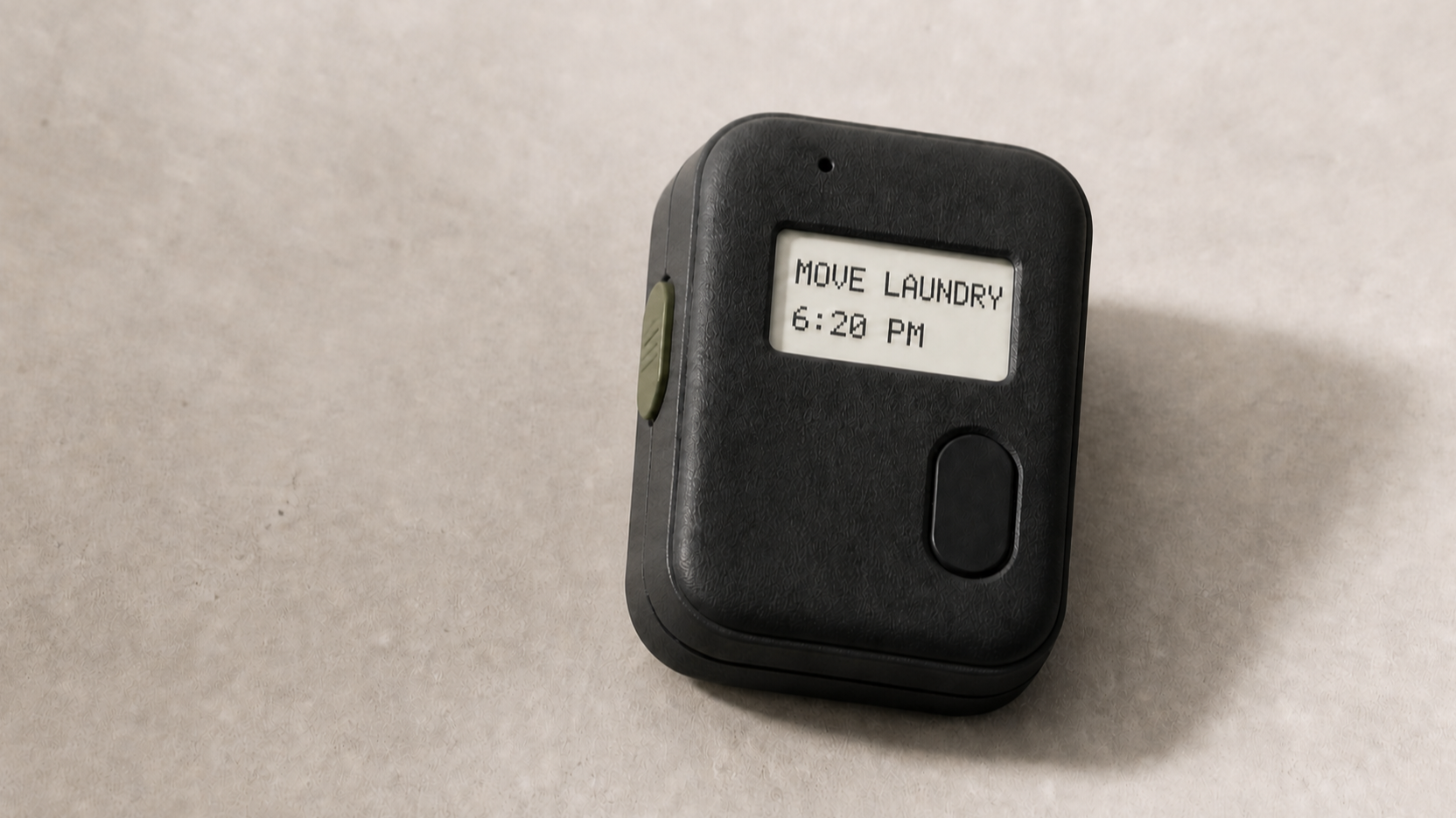 Dimensional concept render of a compact Re-Mind reminder device showing MOVE LAUNDRY at 6:20 PM